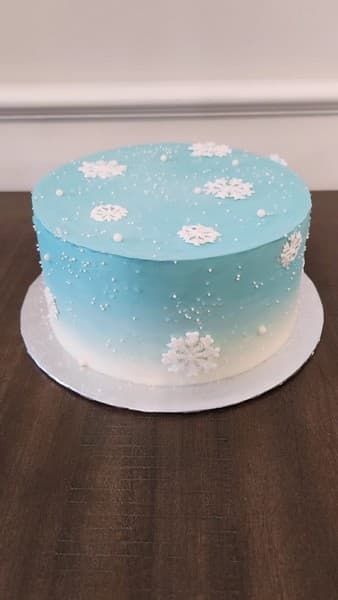 Winter themed cakes with snowflakes on it