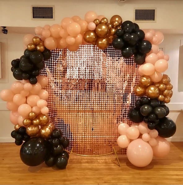 Ballon arch pink, gold and black themed with mesh background for photos